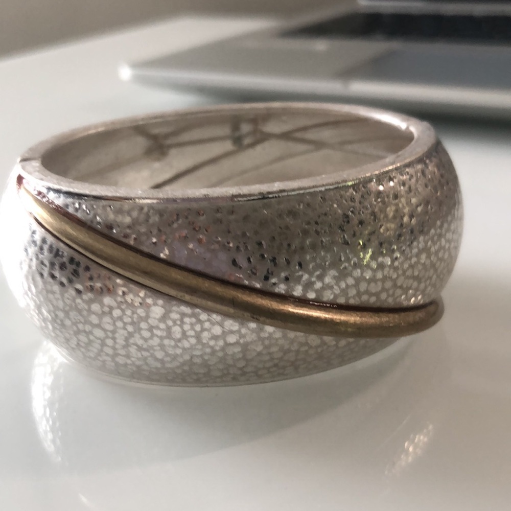 silver and gold tone bracelet.